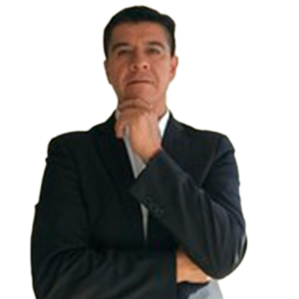 Profile picture of a person with short hair and a beard, wearing a black vest and white shirt, with a blurred outdoor background