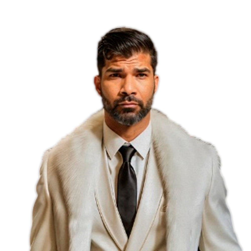 Profile picture of a person with short hair and a beard, wearing a black vest and white shirt, with a blurred outdoor background