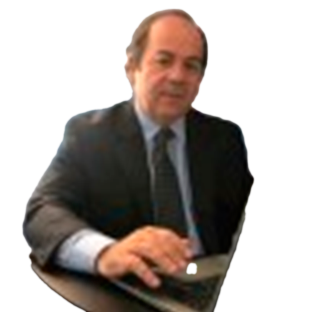 Profile picture of a person with short hair and a beard, wearing a black vest and white shirt, with a blurred outdoor background