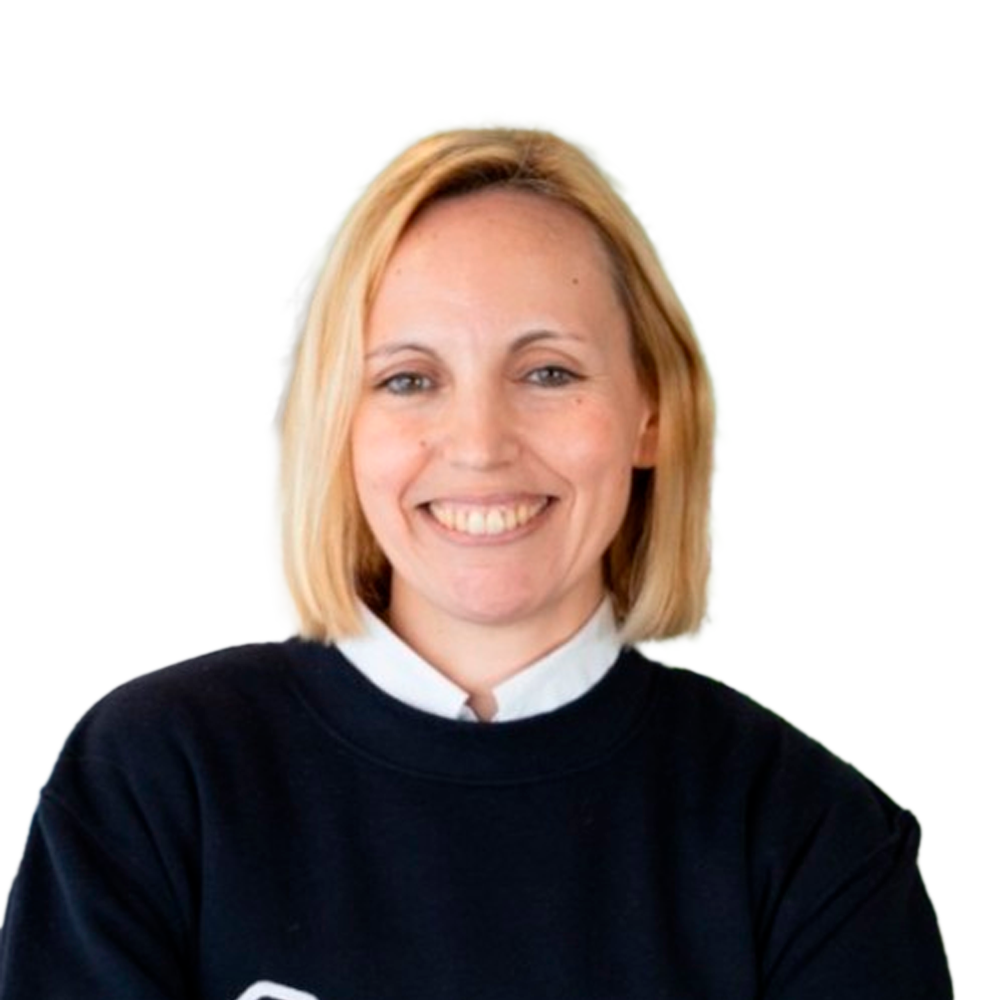 Profile picture of a person with short hair and a beard, wearing a black vest and white shirt, with a blurred outdoor background