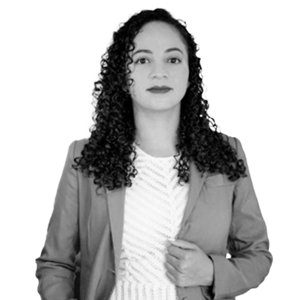 Profile picture of a person with short hair and a beard, wearing a black vest and white shirt, with a blurred outdoor background
