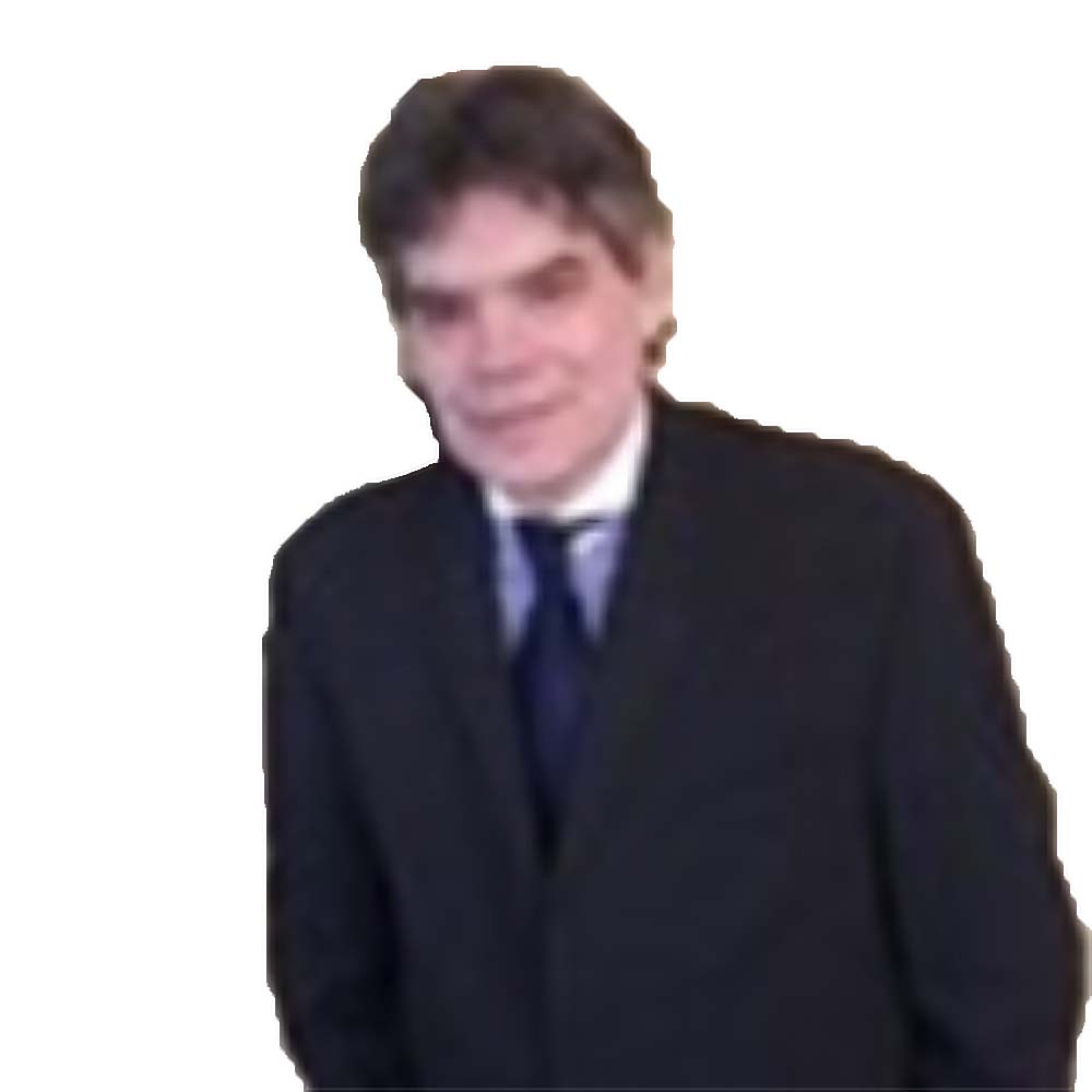 Profile picture of a person with short hair and a beard, wearing a black vest and white shirt, with a blurred outdoor background