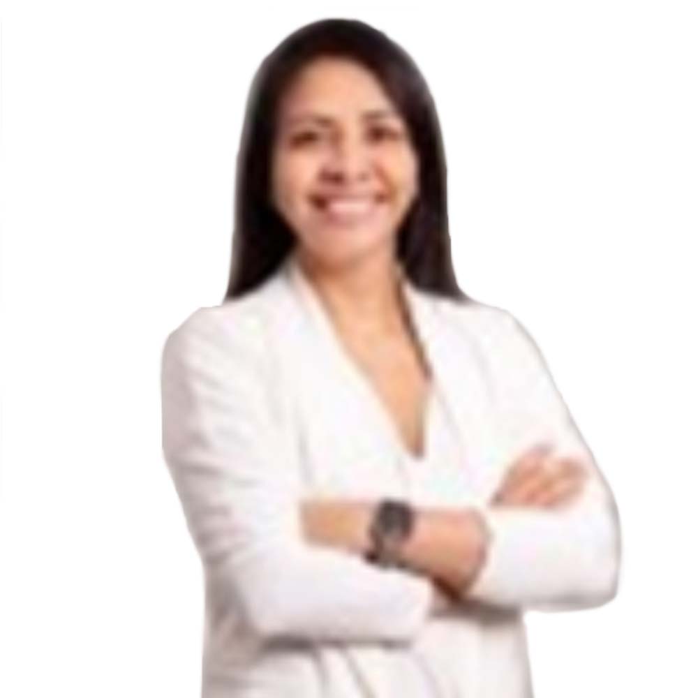 Profile picture of a person with short hair and a beard, wearing a black vest and white shirt, with a blurred outdoor background