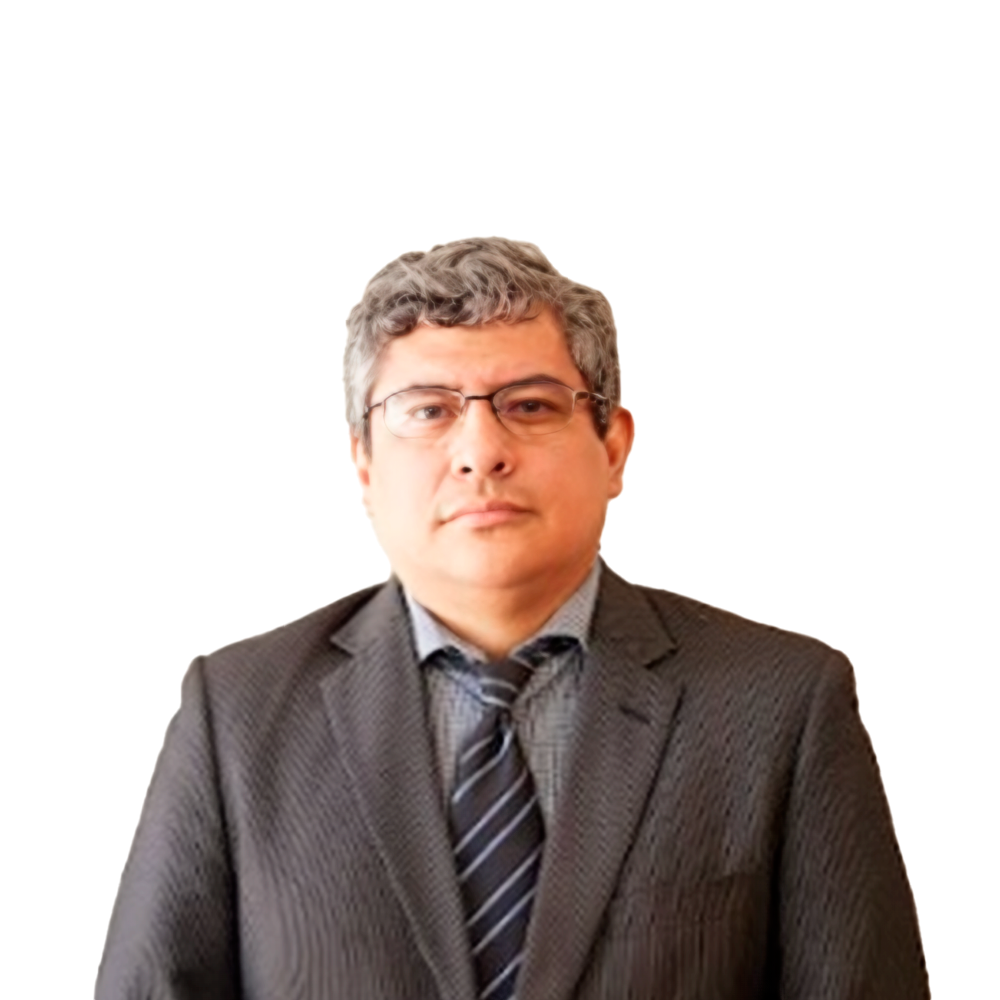 Profile picture of a person with short hair and a beard, wearing a black vest and white shirt, with a blurred outdoor background