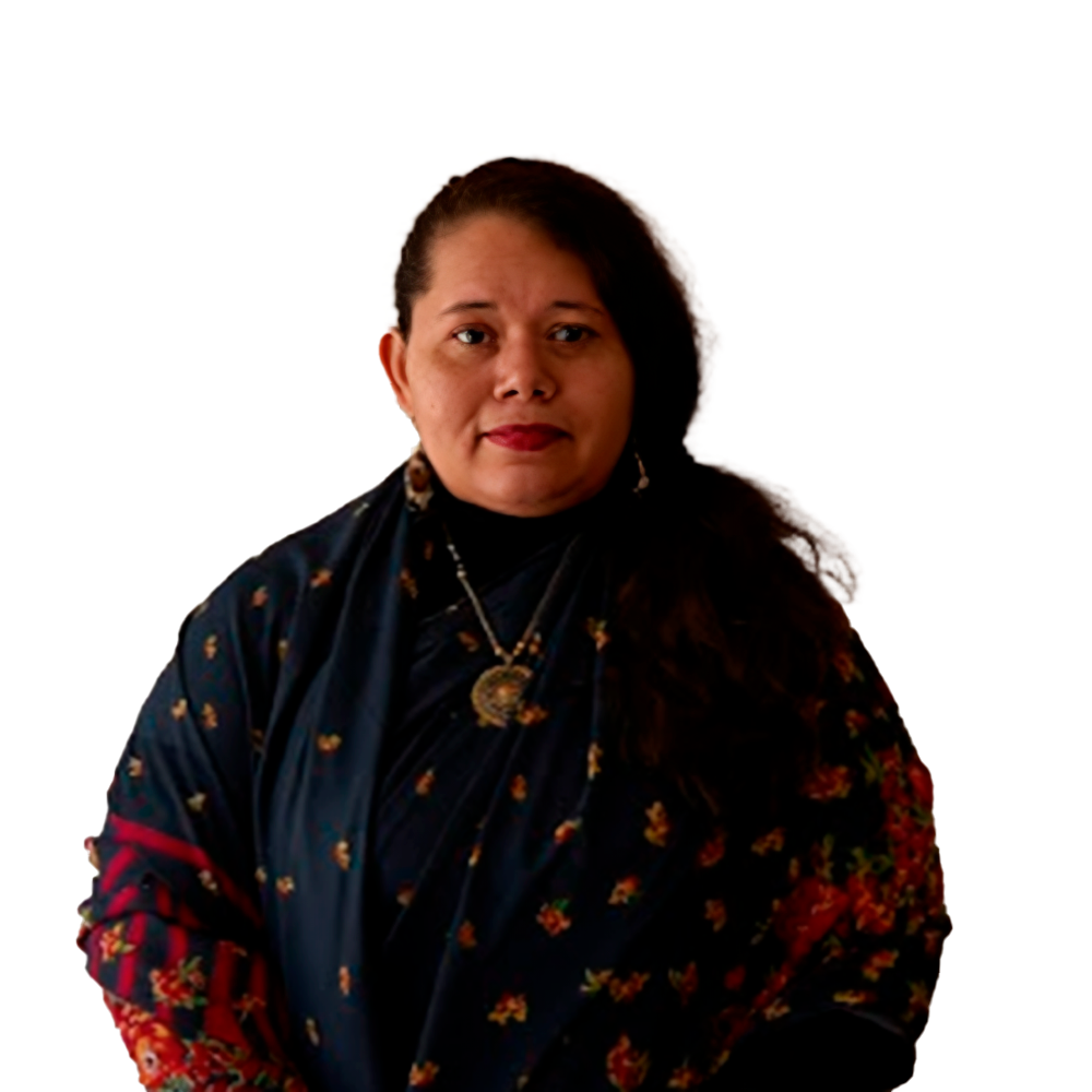 Profile picture of a person with short hair and a beard, wearing a black vest and white shirt, with a blurred outdoor background