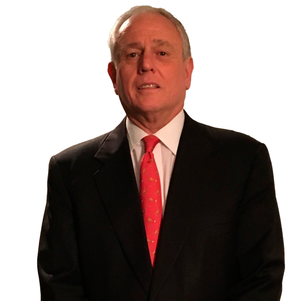 Profile picture of a person with short hair and a beard, wearing a black vest and white shirt, with a blurred outdoor background